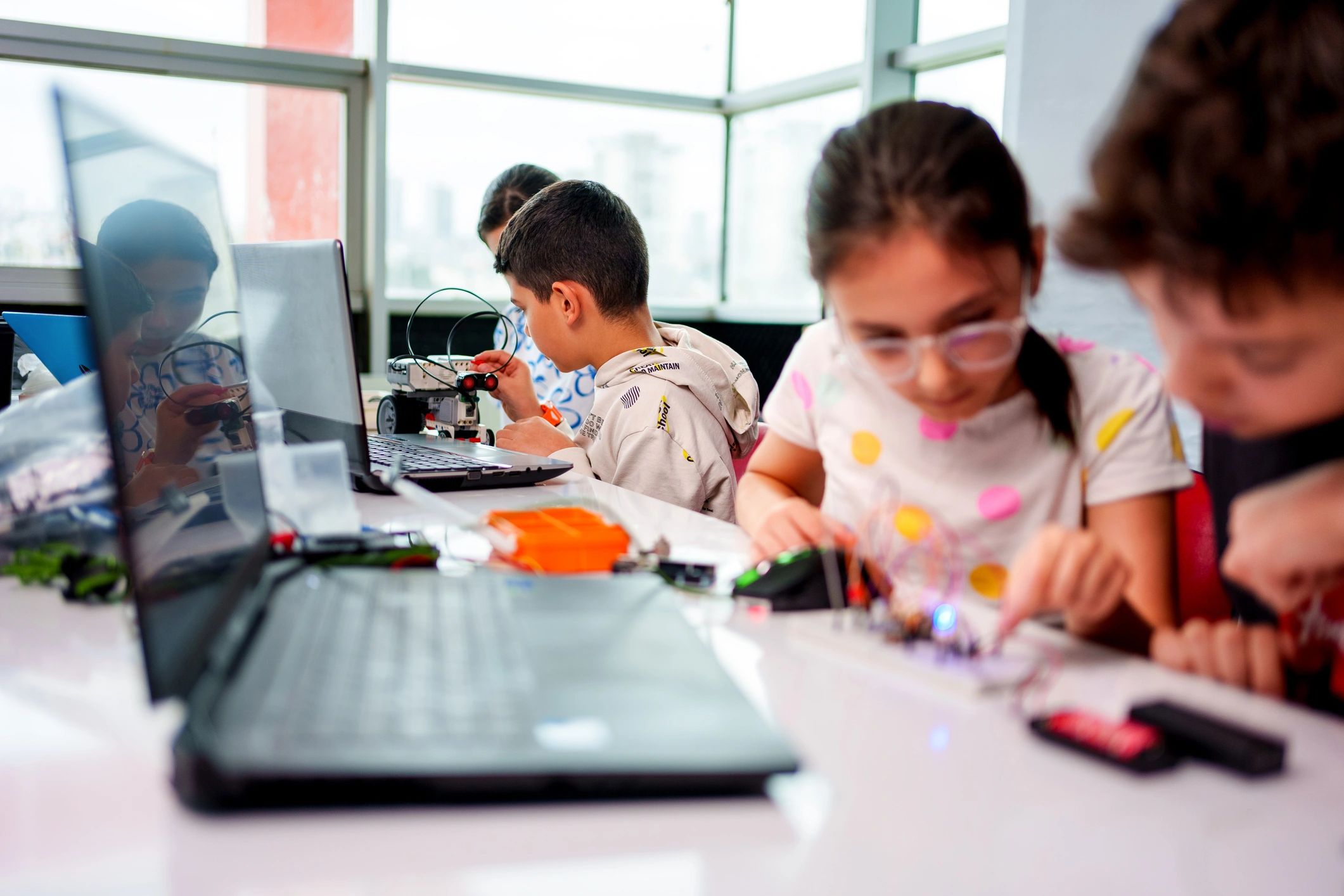 Students working together in a robotics workshop